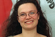 dpa Foto: Lachend steht die damalige Juso-Bundesvorsitzende Andrea Nahles vor einem Plakat der Jungsozialisten (Archiv: 10.05.1997)